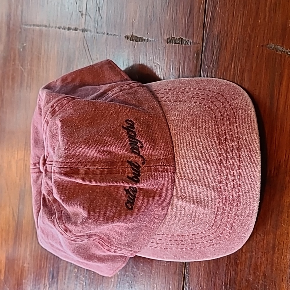 Cute but physco baseball hat. Button on top. Velcro back to adjust size